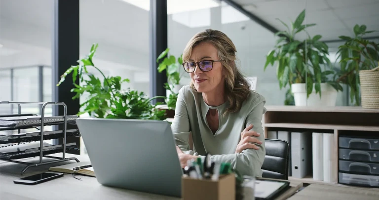 Woman at laptop happy